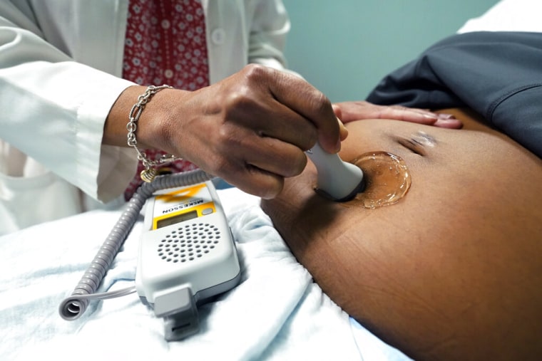 A doctor checks a pregnant patient in Jackson, Mississippi, on December 17, 2021.
